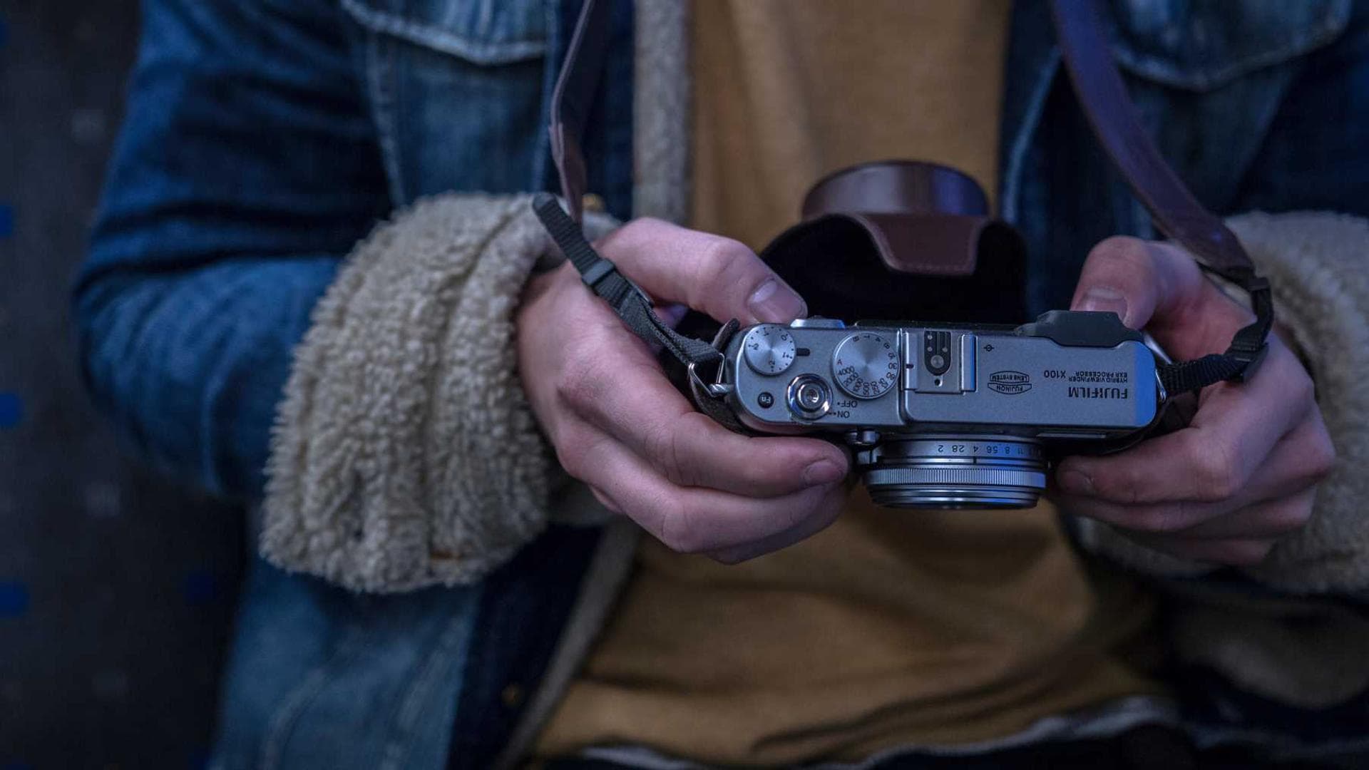 A professional camera lens with dramatic lighting